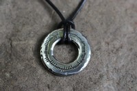 Ogham ring pendant on leather thong Photo