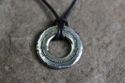 Ogham ring pendant on leather thong